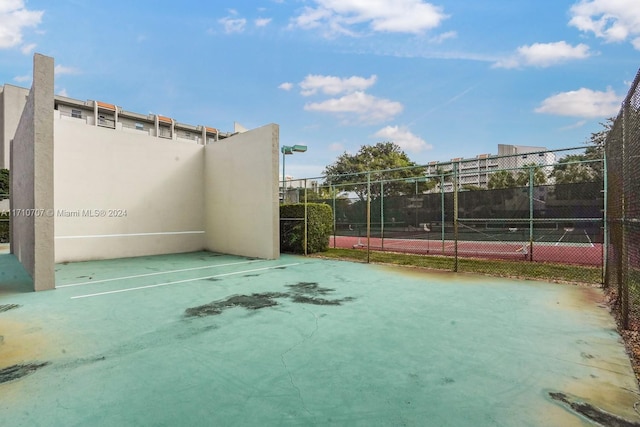 view of patio with tennis court