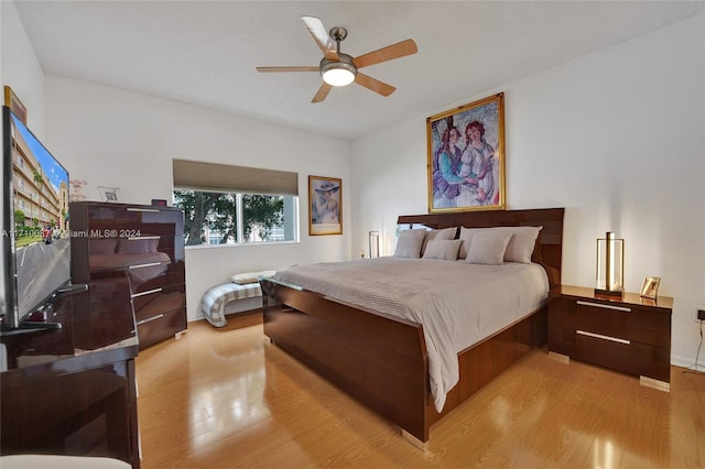 bedroom with ceiling fan and light hardwood / wood-style floors