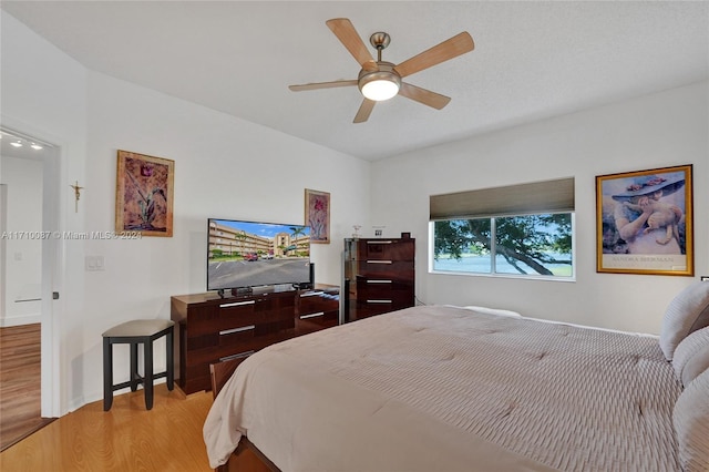 bedroom with light wood-type flooring and ceiling fan