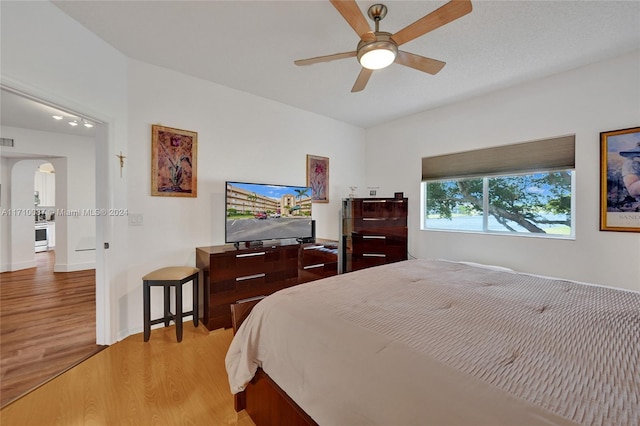 bedroom featuring ceiling fan and light wood-type flooring