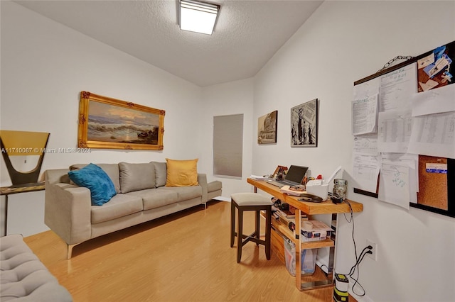 office area featuring hardwood / wood-style floors and a textured ceiling