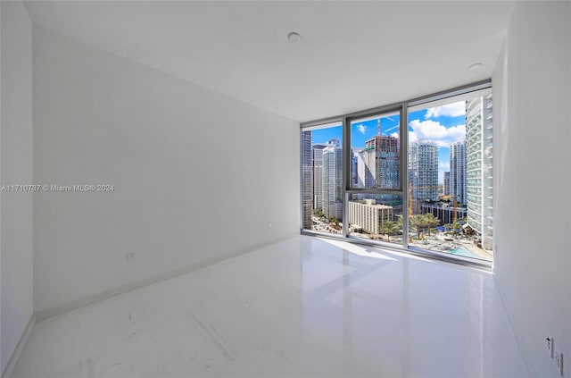 empty room featuring floor to ceiling windows