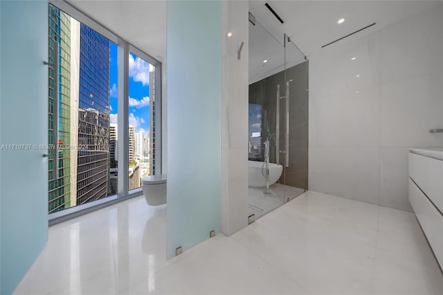 bathroom with vanity and floor to ceiling windows