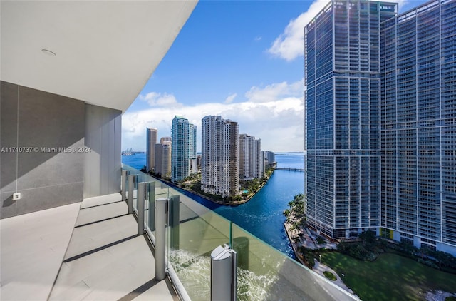 balcony featuring a water view