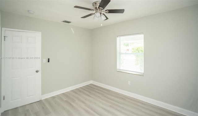 unfurnished room with ceiling fan and light wood-type flooring