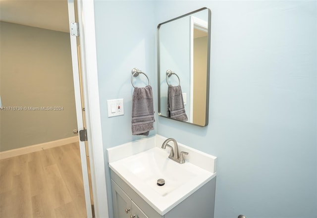 bathroom featuring hardwood / wood-style flooring and vanity