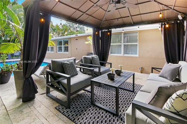 view of patio / terrace with an outdoor pool, a gazebo, and an outdoor hangout area