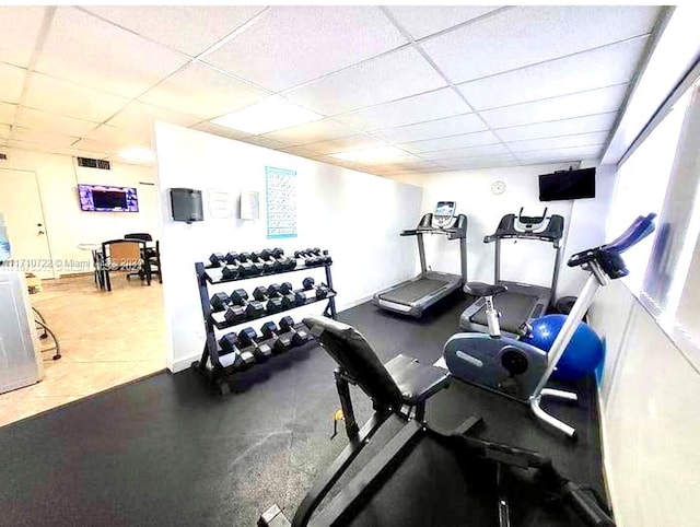 exercise area featuring a drop ceiling