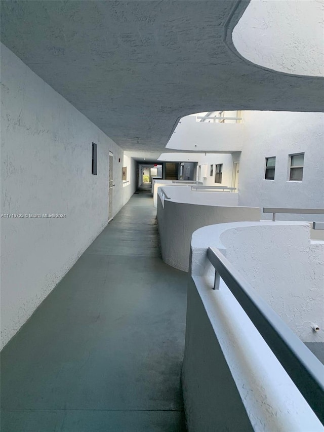 hall featuring concrete floors