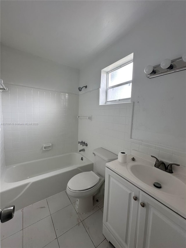 1733 Mayo St Unit 2, Hollywood, FL 33020 - full bath with shower / washtub combination, toilet, vanity, tile patterned floors, and tile walls