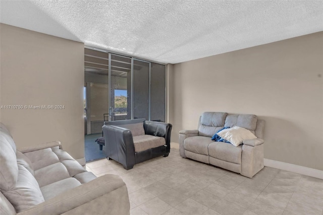 living room with a textured ceiling