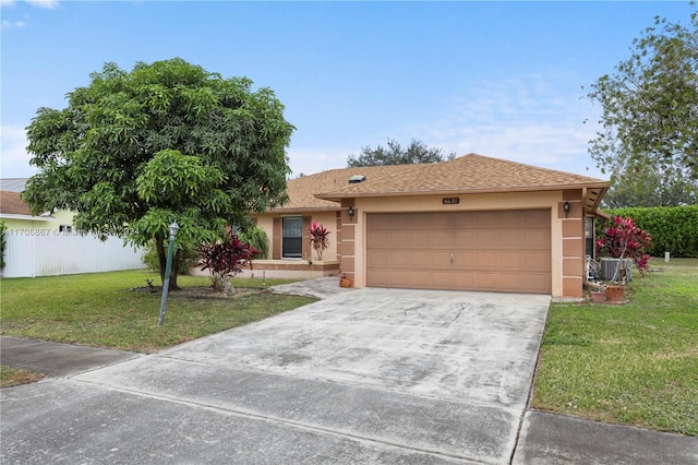 ranch-style house featuring a front lawn and a garage