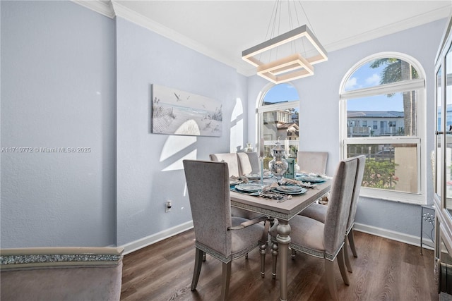 dining area with dark hardwood / wood-style flooring and a wealth of natural light