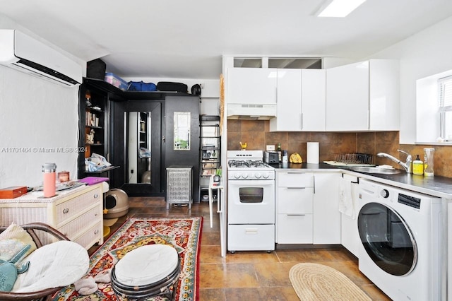 kitchen featuring a wall unit AC, washer / clothes dryer, white cabinets, exhaust hood, and white gas range oven