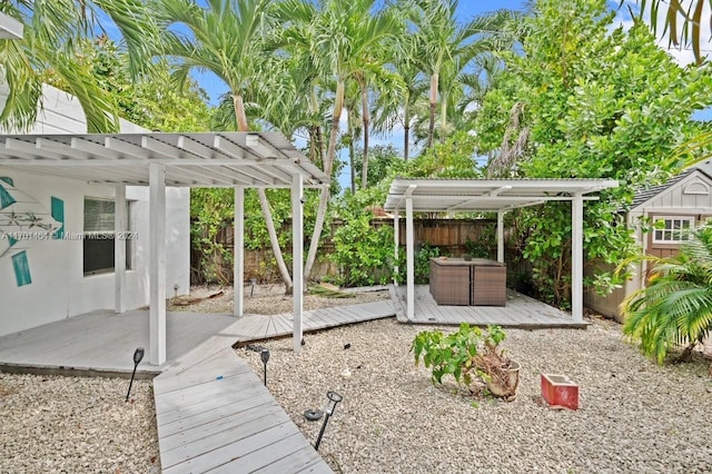 view of yard featuring a pergola and a wooden deck