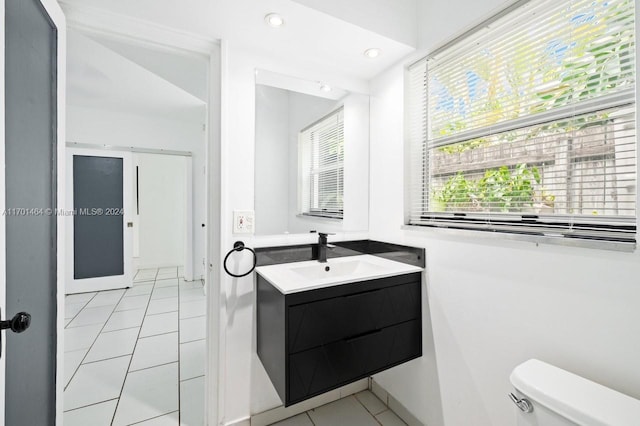 bathroom with tile patterned floors, vanity, and toilet