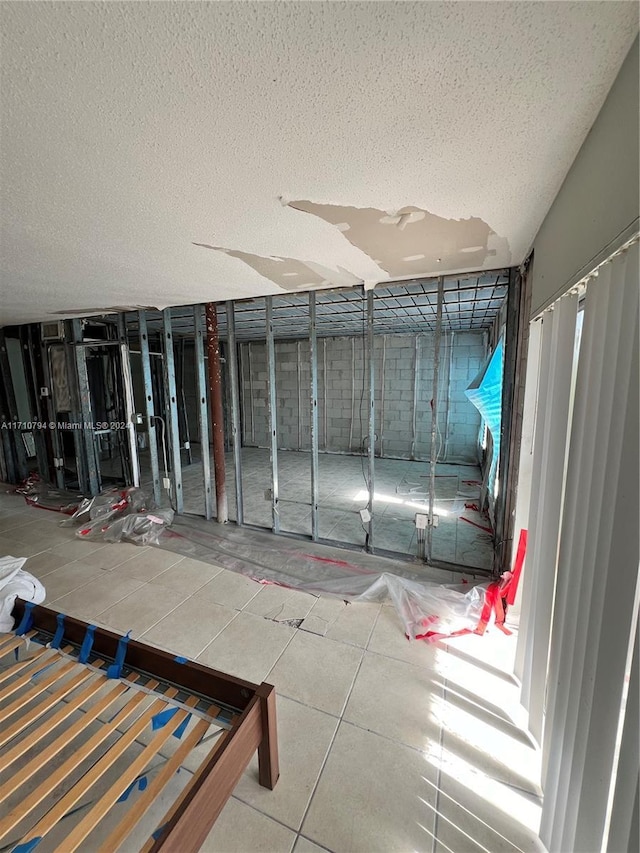 interior space with a textured ceiling