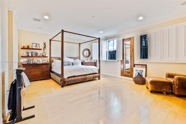 bedroom with light hardwood / wood-style floors