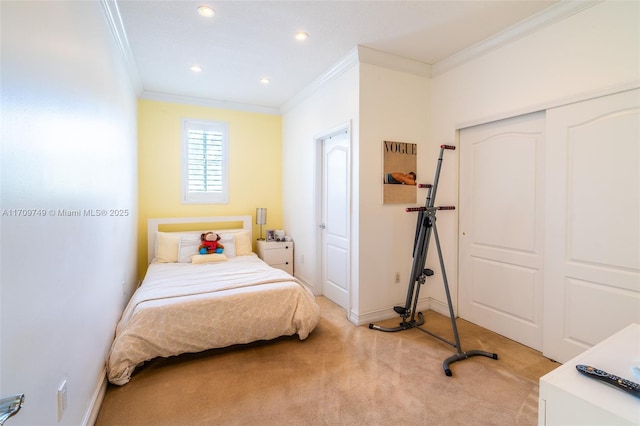 bedroom featuring a closet, light colored carpet, and ornamental molding