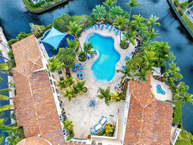 birds eye view of property featuring a water view