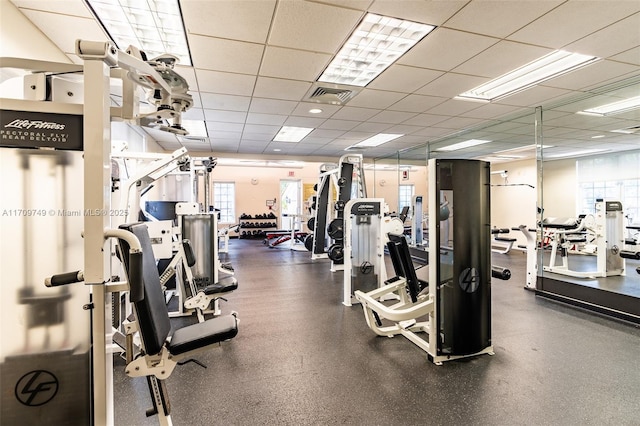 exercise room with a drop ceiling