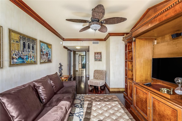 living room featuring dark hardwood / wood-style floors, ceiling fan, and crown molding