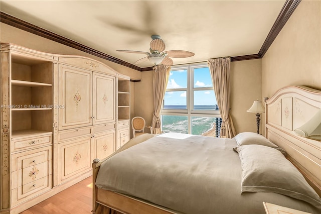 bedroom featuring ceiling fan, a water view, crown molding, and light hardwood / wood-style flooring