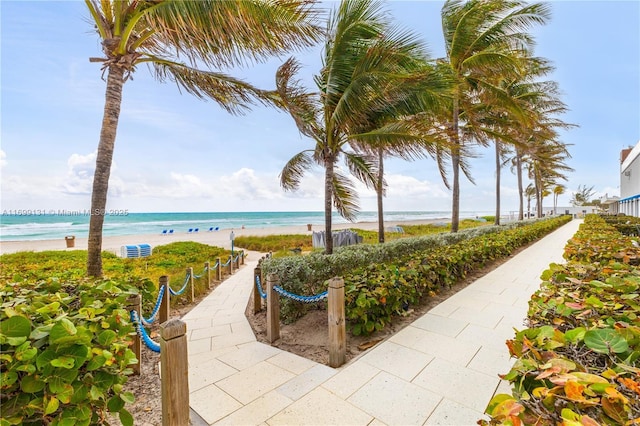 view of community featuring a water view and a view of the beach