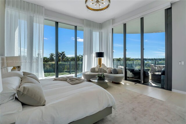 bedroom featuring a spacious closet and a chandelier