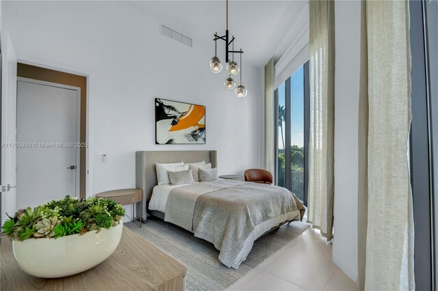 bedroom with light tile patterned floors