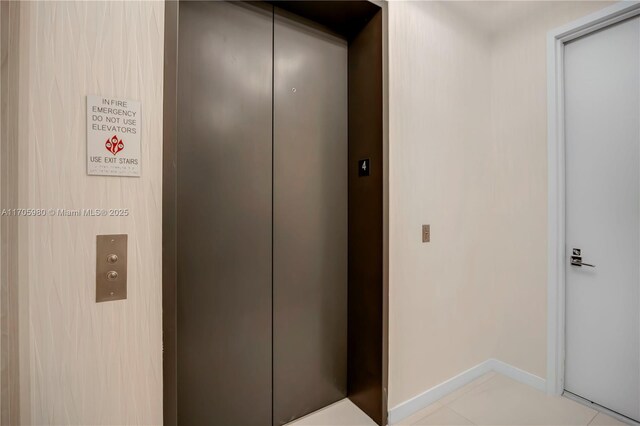 mudroom featuring light tile patterned flooring