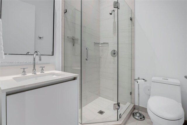 bathroom with tile patterned floors, vanity, and toilet