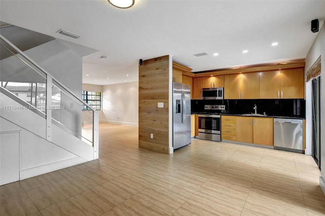 kitchen with decorative backsplash, stainless steel appliances, and sink