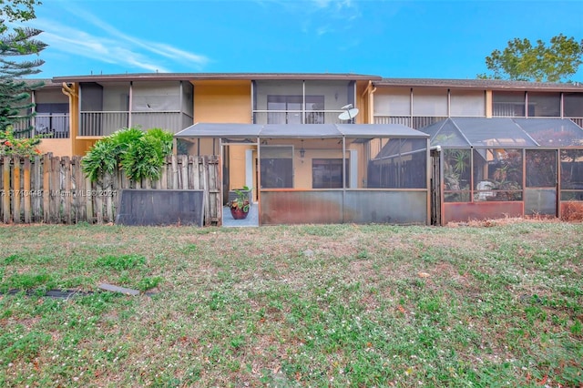 rear view of property with a lanai