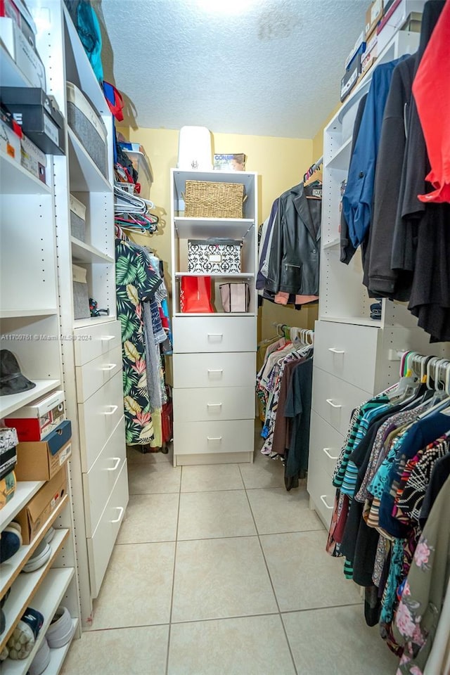 spacious closet featuring light tile patterned floors