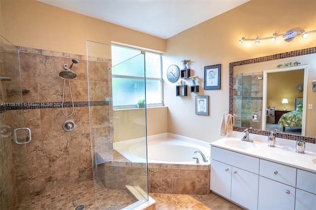 bathroom featuring separate shower and tub and vanity