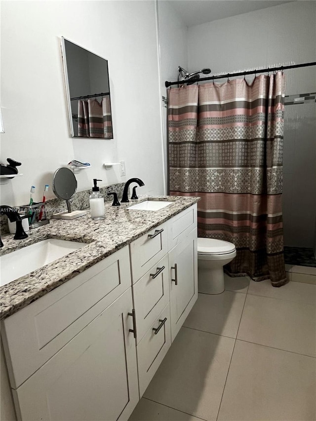 bathroom with tile patterned floors, vanity, toilet, and a shower with curtain