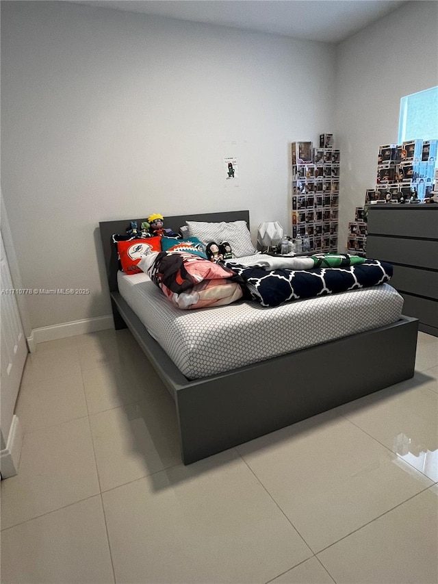 bedroom featuring tile patterned flooring