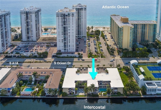 birds eye view of property with a water view