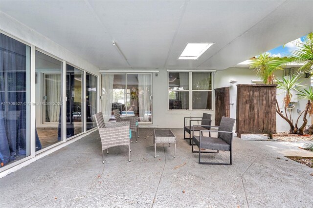 view of pool featuring a patio and a sunroom