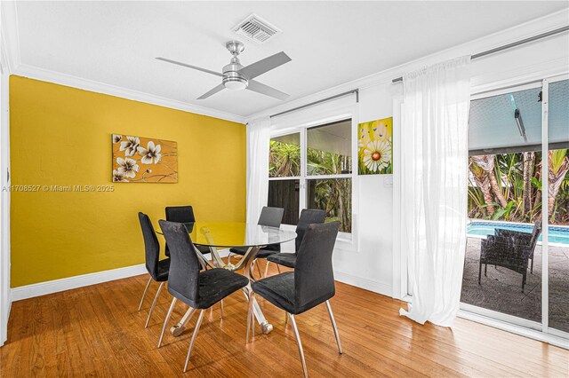 living room featuring ceiling fan, crown molding, and hardwood / wood-style floors