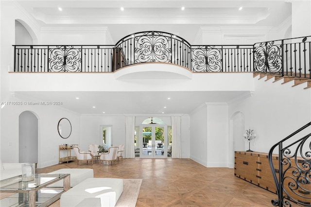 entrance foyer with ornamental molding and french doors