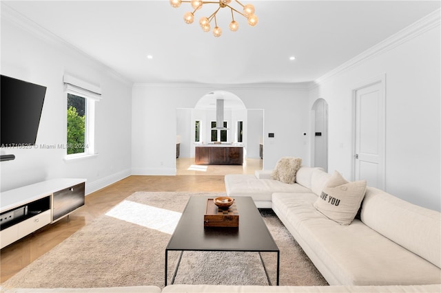 living room featuring ornamental molding and a chandelier