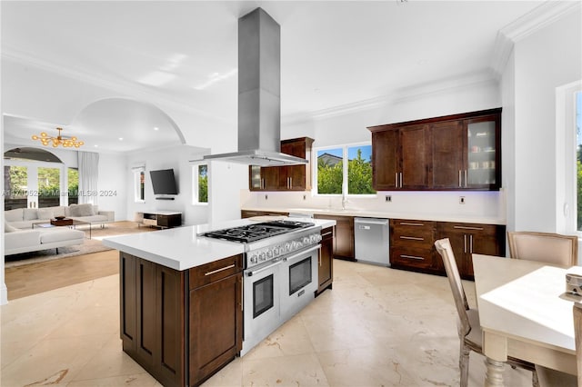 kitchen featuring appliances with stainless steel finishes, island range hood, and crown molding