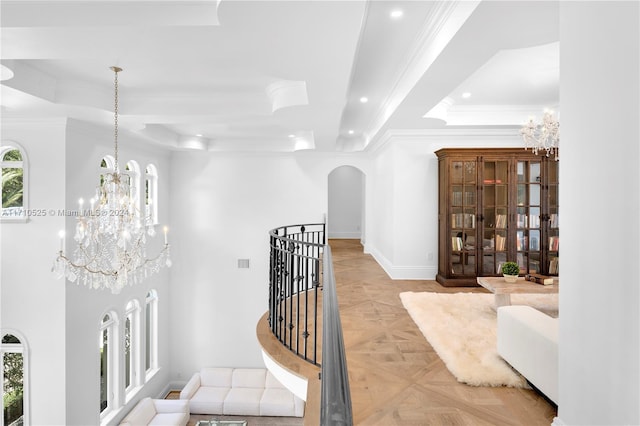 corridor with light parquet floors and ornamental molding