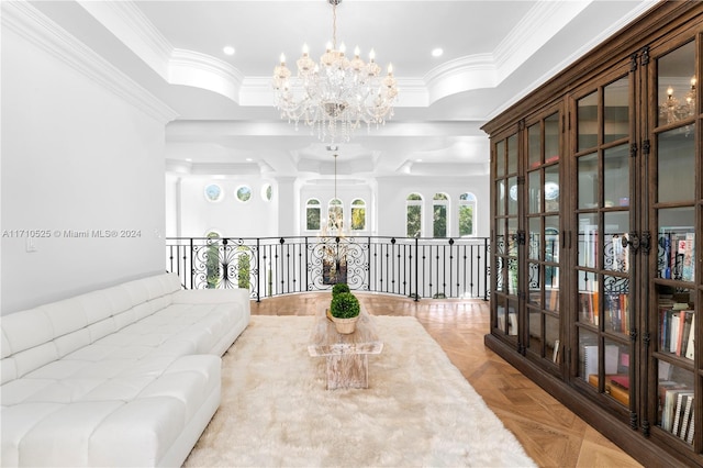 interior space featuring a chandelier, light parquet flooring, and crown molding