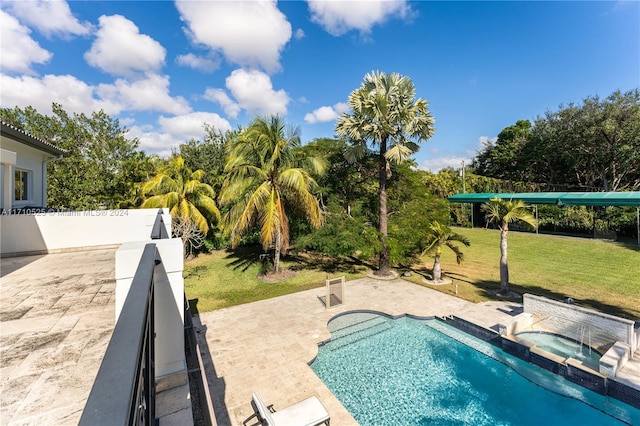 view of swimming pool with a yard and a patio