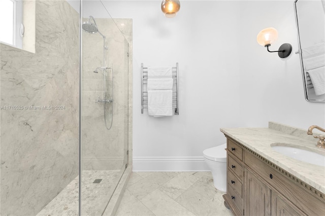 bathroom featuring tiled shower, radiator, vanity, and toilet