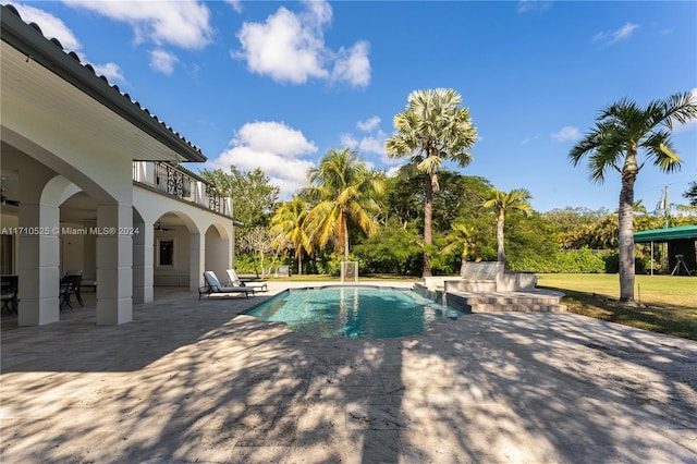 view of swimming pool featuring a patio area