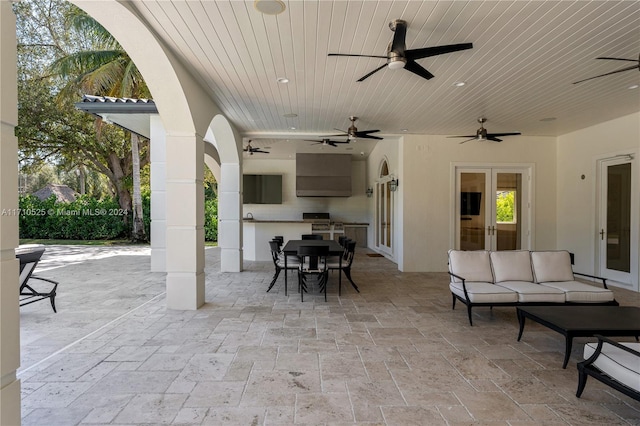 view of patio / terrace with area for grilling and french doors